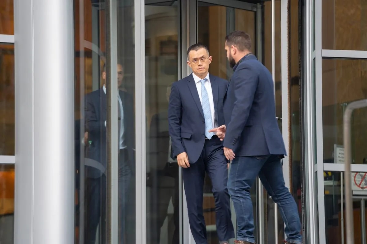 CZ Binance Stepping Out Of A Place Along with a Bodyguard