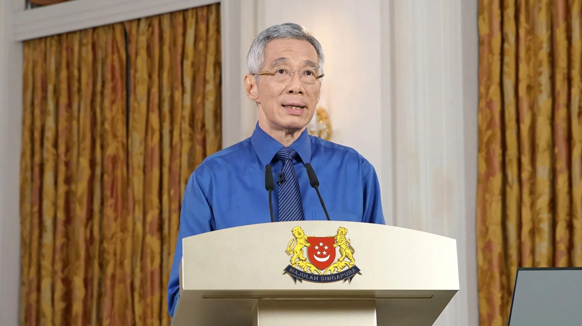 Lee Hsien Loong, Prime Minister of Singapore wearing Blue Shirt and giving a speech