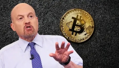 Jim Cramer wearing White shirt and blue tie, bitcoin logo at the back