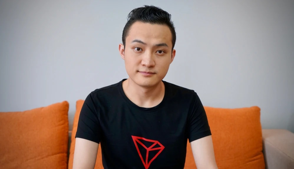 Justin Sun wearing a TRON T-shirt